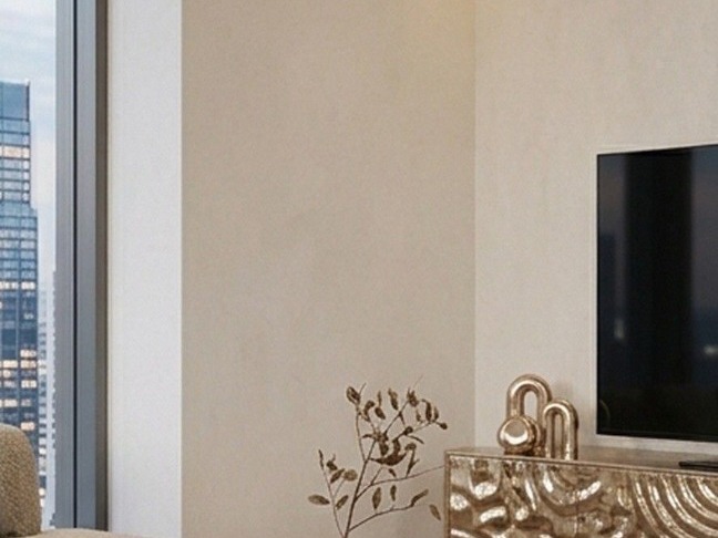 Living de alto padrão com painel em VITRUwave aço inox textura de água